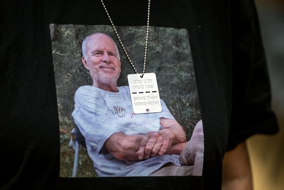 Former Hamas hostage Aviva Siegel poses with a t-shirt showing a picture of her husband Keith Siegel during an interview with AFP, while on her visit to the 55th session of the UN Human Rights Council in Geneva on Feb. 28, 2024. Aviva Siegel was released on Nov/ 26, 2023, her husband is still being held hostage.
