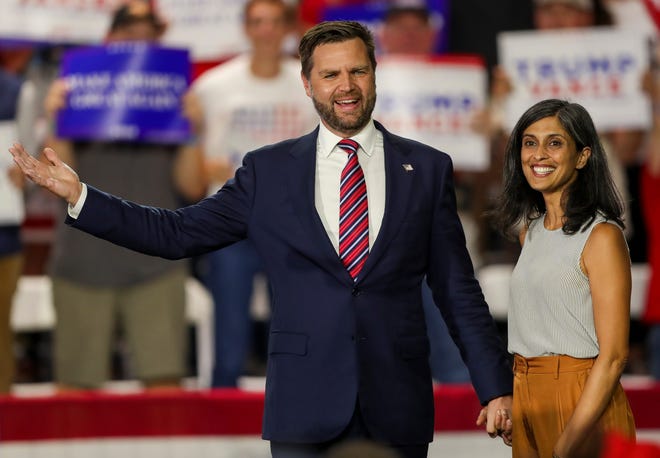 JD Vance, Vice President-elect and his wife, Usha Vance, walk on stage during a campaign rally in at AmeriLux in De Pere, Wisconsin on Aug. 28, 2024,