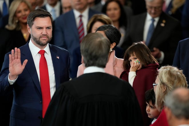 JD Vance is sworn in as vice president by Supreme Court Justice Brett Kavanaugh as Usha Vance holds the Bible during the 60th Presidential Inauguration in the Rotunda of the U.S. Capitol in Washington, Monday, Jan. 20, 2025.