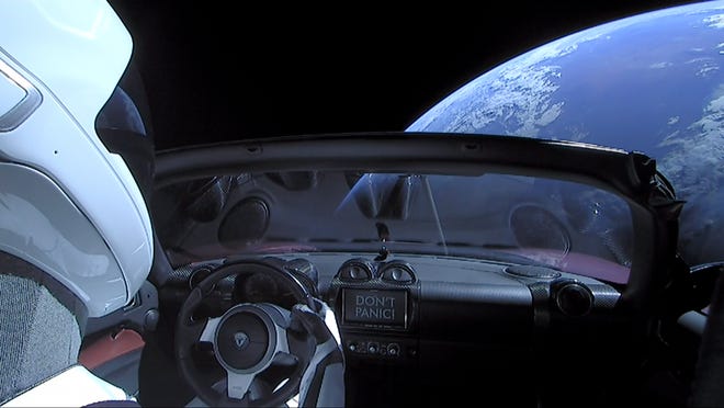 In this 2018 handout photo provided by SpaceX, a Tesla Roadster launched from the Falcon Heavy rocket with a dummy driver named "Starman" heads towards Mars.