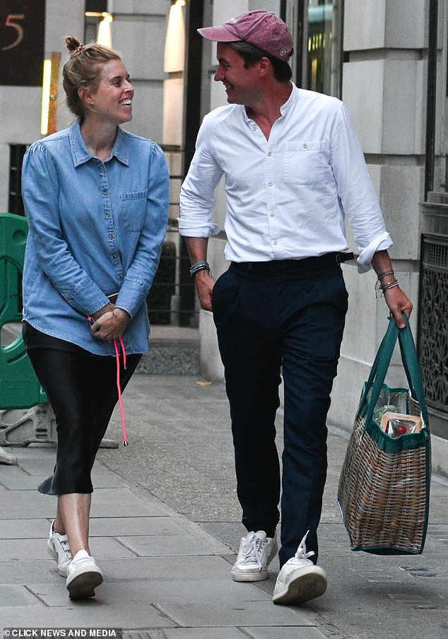 Beatrice - who is the daughter of Sarah Ferguson and Prince Andrew - donned a casual, oversized denim shirt and black midi skirt