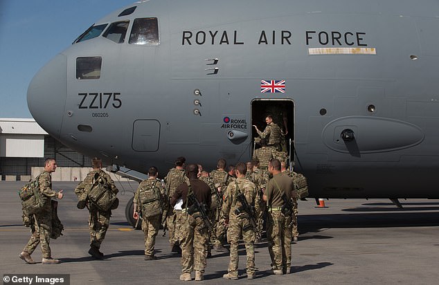A Whitehall source previously claimed the hapless incident sparked a transatlantic spat as fears were raised that the breach could endanger US servicemen and women (Pictured: soldiers leaving Afghanistan in 2014)