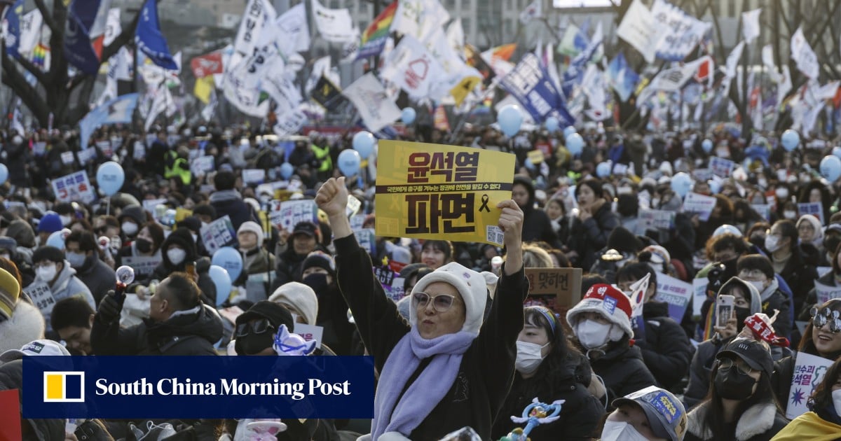 South Korea’s Yoon in court as investigators seek to extend detention