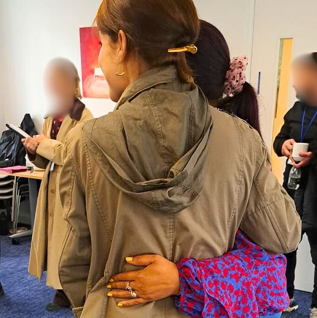Eugenie wears a khaki bomber jacket with sequinned embellishments on the shoulder and subtle pieces of gold jewellery as she meets survivors of modern slavery