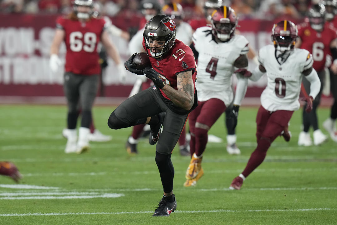 Tampa Bay Buccaneers wide receiver Mike Evans (13) runs against the Washington Commanders during the first half of an NFL wild-card playoff football game in Tampa, Fla., Sunday, Jan. 12, 2025. (AP Photo/Chris O'Meara)