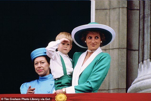 Princess Margaret is a reassuring presence behind Princess Diana, who is holding three-year-old Prince Harry, on the balcony at Buckingham Palace in 1988