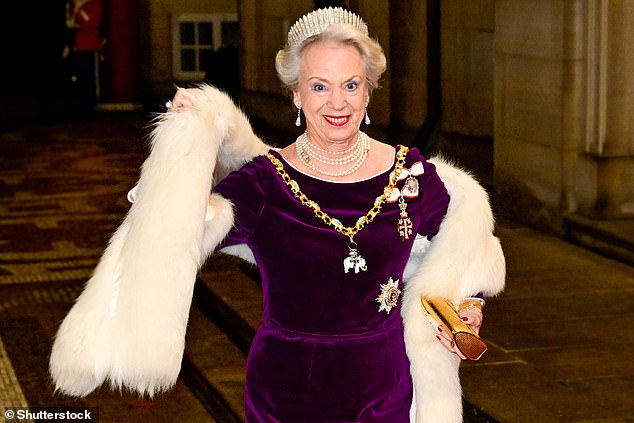 Princess Benedikte looked dazzling in a tiara, purple dress, pearl necklaces and a white fur shawl