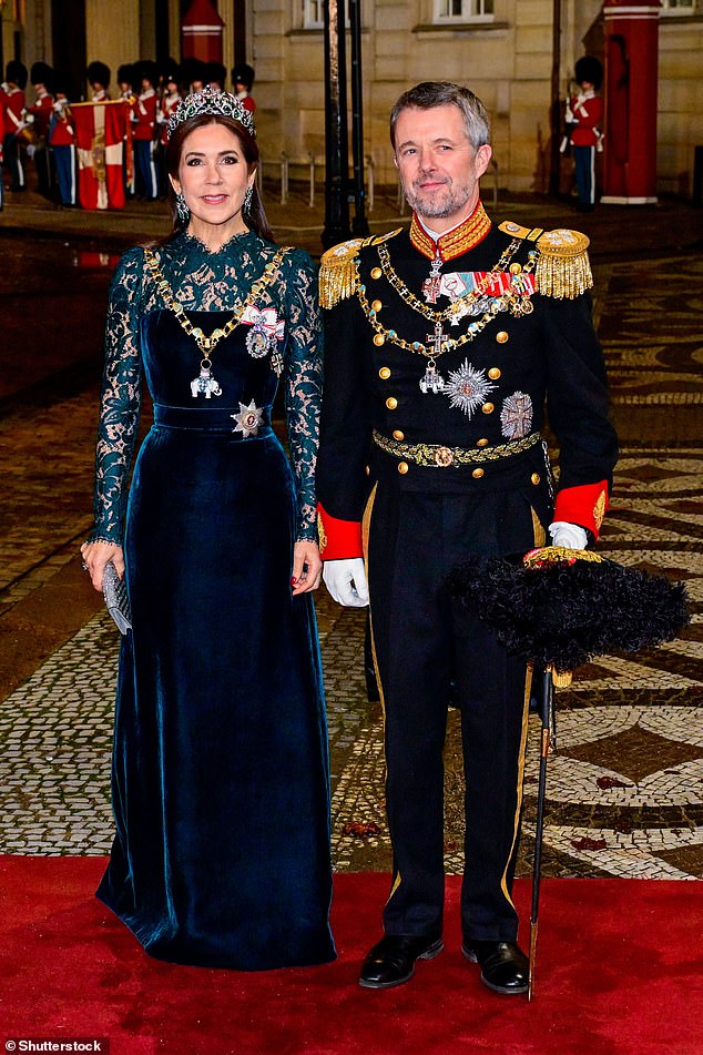 Queen Mary teamed her velvet number with an emerald and diamond tiara and matching earrings, while sporting a glamorous makeup look and holding a sparkly silver clutch
