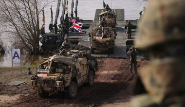 British troops driving Jackal combat vehicles descend from M3 amphibious rigs of the German/British Amphibious Engineer Battalion 130 after crossing the Vistula River during the NATO Dragon 24 military exercise on March 4, 2024