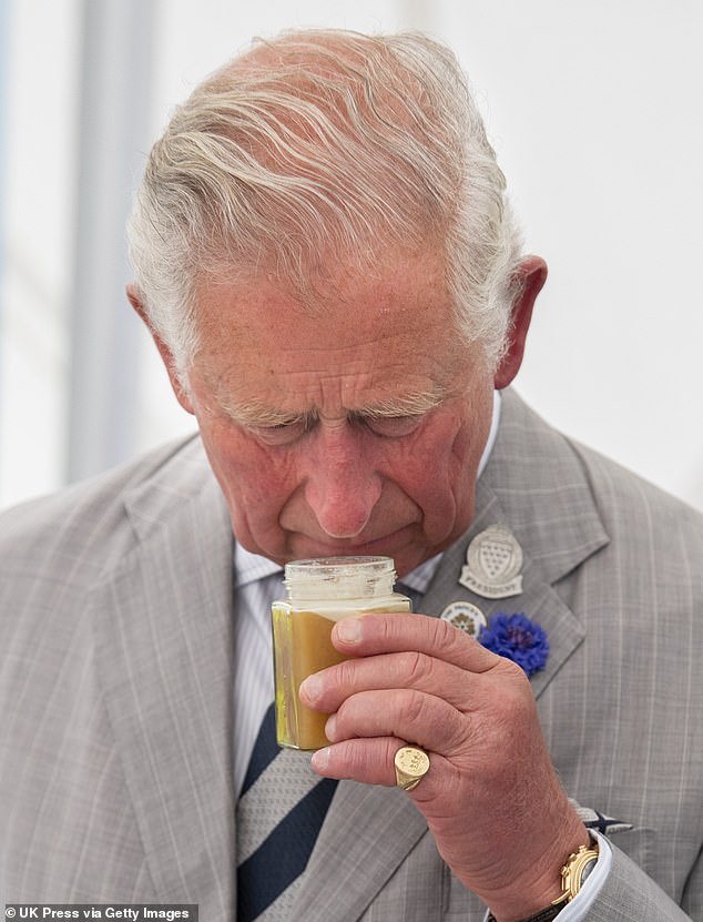 The King taking a sniff of local honey during a visit to Exmoor National Park in 2019