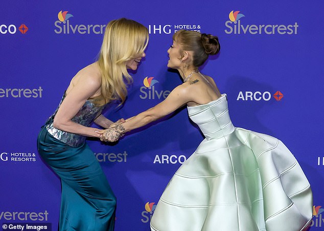 Nicole, 57, had to bend double to congratulate the 31-year-old star of Wicked