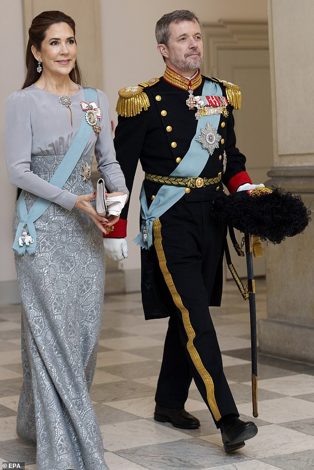 Denmark's King Frederik and Queen Mary arrive at the royal couple's New Year's reception for officers from the armed forces at Christiansborg Palace in Copenhagen on Tuesday