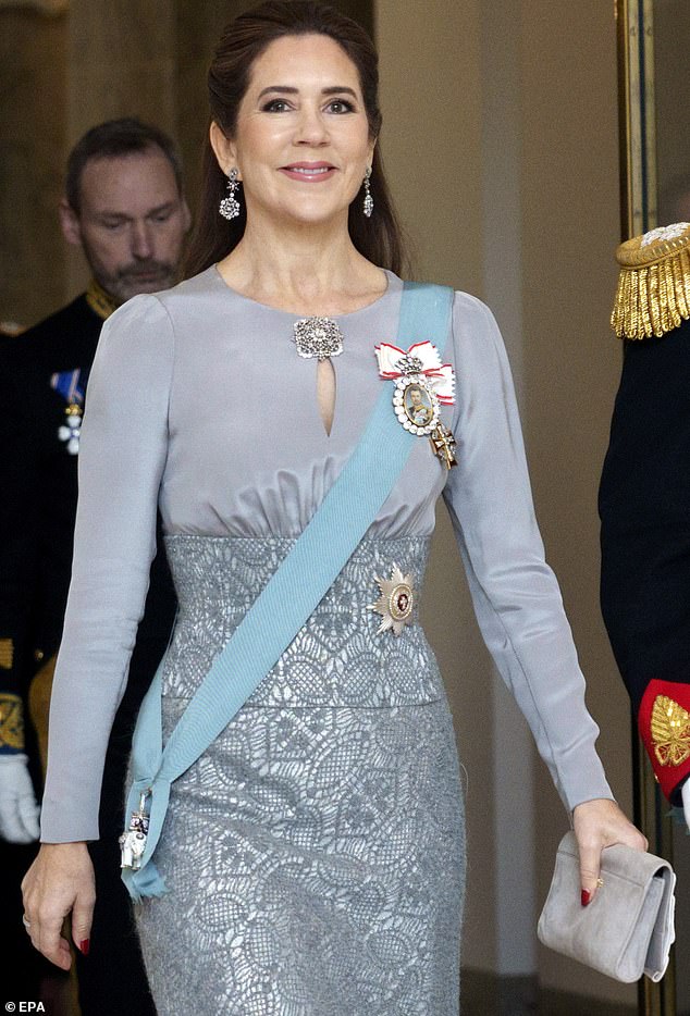 Australian-born Queen Mary looked chic in a grey dress handmade by luxury Danish designer Julie Fagerholt