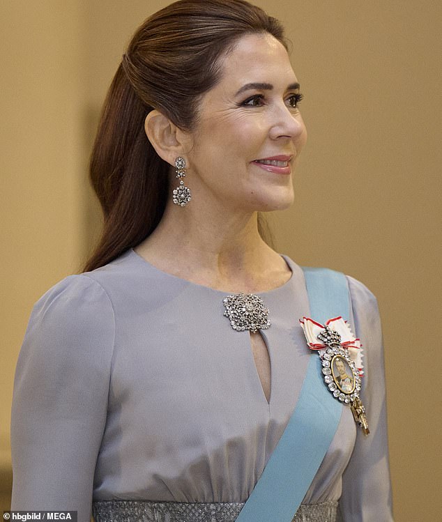52-year-old Queen Mary looked fresh faced, opting for a natural make-up look, and simple hair style