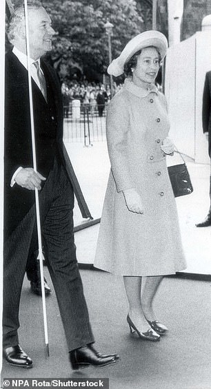Queen Elizabeth wore an orange Hardy Amies coat when she visited the Houses of Parliament in 1977