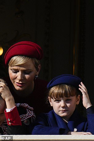 Her look was completed with a custom Stephen Jones hat, echoing the navy version worn by Gabriella