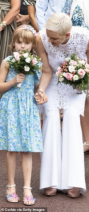 Gabriella also carried a bouquet identical to her mother's