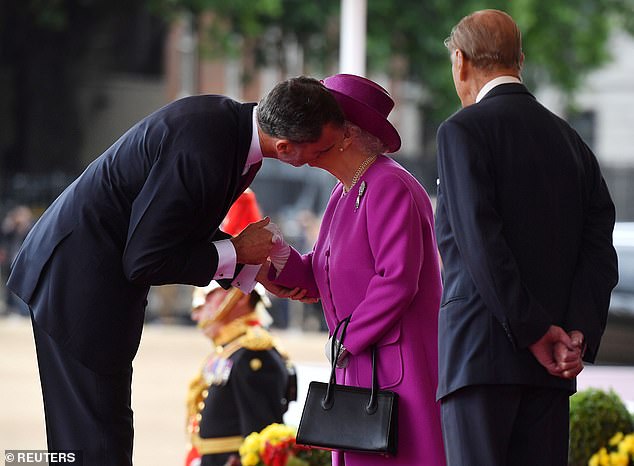 The king had to stoop when he was welcomed by Queen Elizabeth at Horse Guards Parade while visiting London on a state visit in 2017