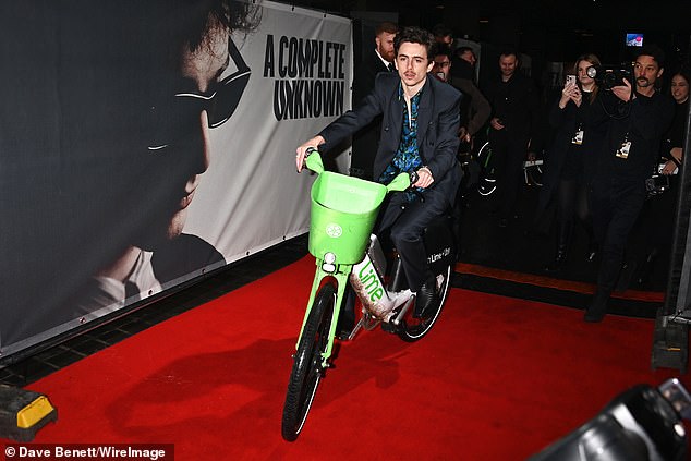 US actor Timothee Chalamet rides an electric Lime bike on to the red carpet in London