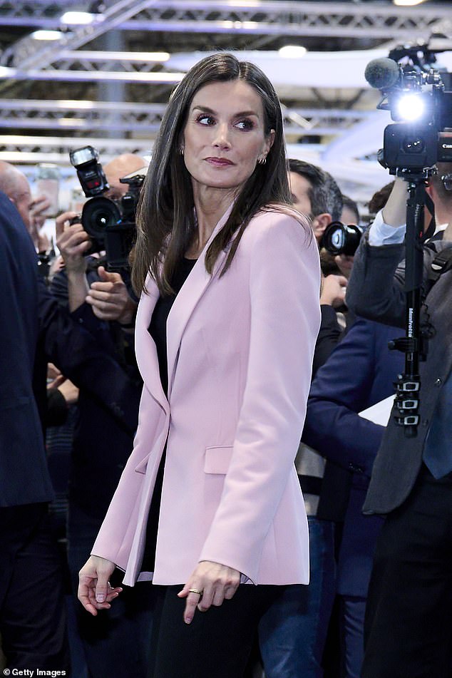 The mother-of-two stepped out in a bubblegum pink blazer with ribbed detailing to highlight her elegant physique