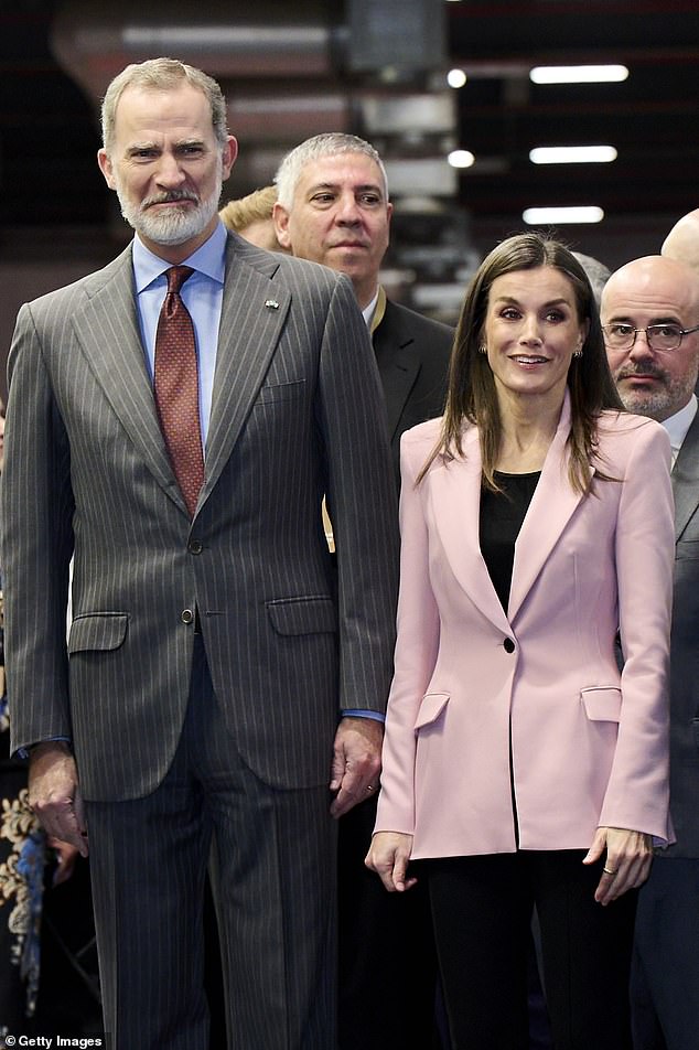 Queen Letizia of Spain looked stunning in a rose-coloured blazer as she attended a tourism fair in Madrid today with her husband King Felipe