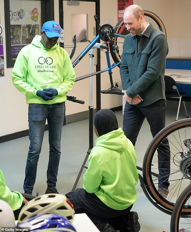 Pictured: Prince William smiled as he met young participants building and maintaining bikes during his visit to Cycle of Life