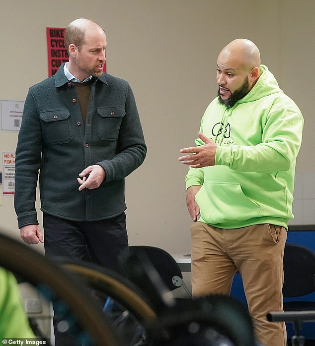 The father-of-three appeared focused as he chatted with Cycle of Life founder Ibe Hayter (pictured right)