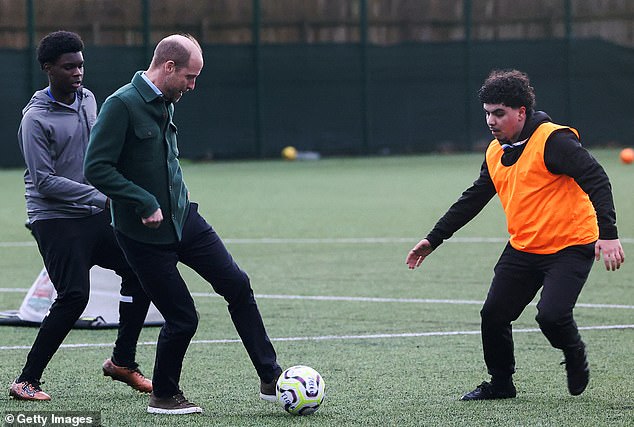 Prince William, Prince Of Wales plays football, as he meets with members of Tiber Young People's Steering Group