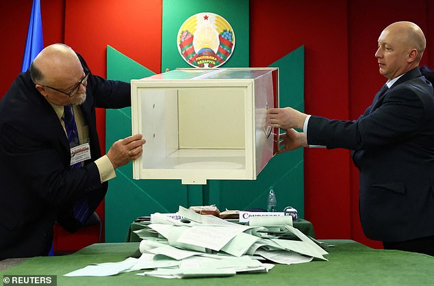 Members of an electoral commission empty a ballot box to count votes during the presidential election in Minsk, Belarus, on January 26