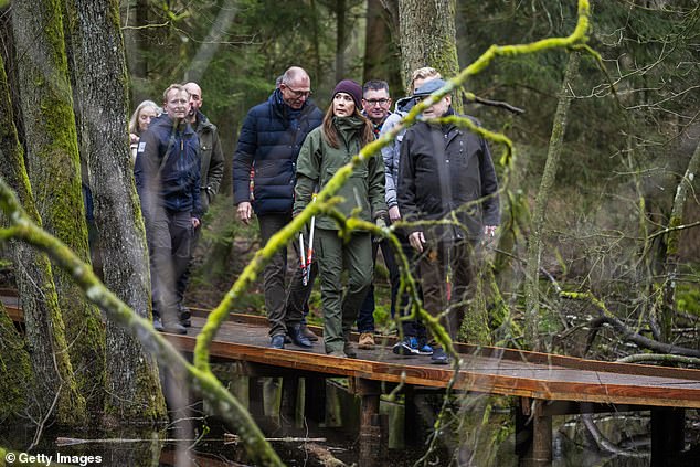Later on she made sure to walk alongside the duo through along the wooden forest path that snaked through the trees before enjoying some refreshments