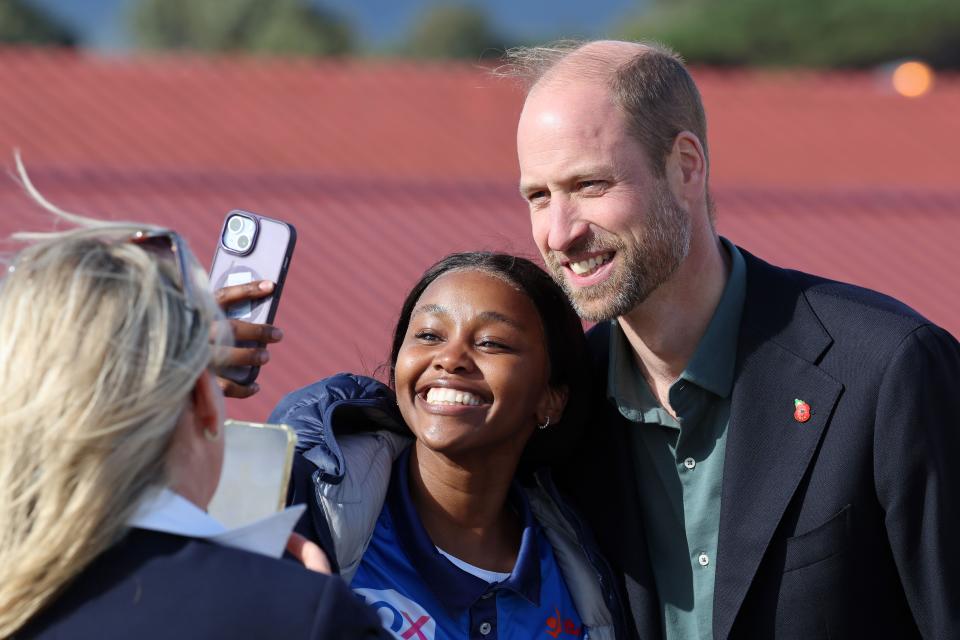 Prince William, Prince of Wales poses for s selfie with a student at Ocean View Secondary School on November 04, 2024 in Cape Town, South Africa. During his visit, The Prince of Wales will attend the fourth annual Earthshot Prize Awards and engaged in various environmental initiatives and participated in events held in Cape Town as part of 'Earthshot Week'. (Photo by Chris Jackson/Getty Images)