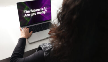 Woman using laptop with artificial intelligence screen
