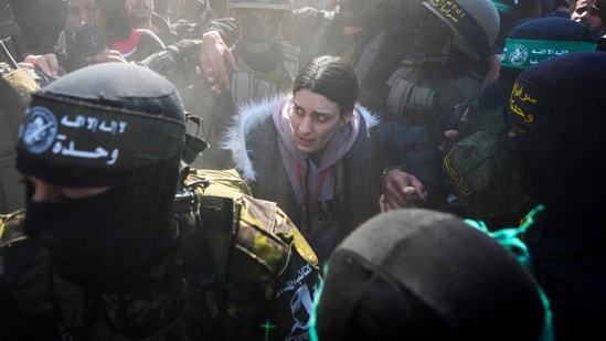 29-year-old Arbel Yehoud was escorted by Hamas and Islamic Jihad fighters and handed over to the Red Cross in Khan Younis(AP)