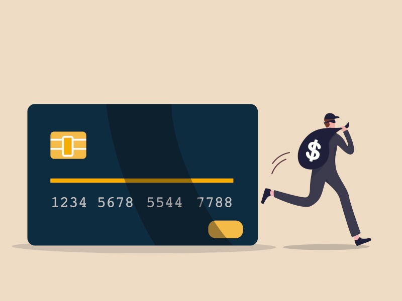 Credit card online hacking, online hacking or financial robbery concept, young mysterious thief with dark black robbery running with big bag with dollar sign money sign from credit card online payment.