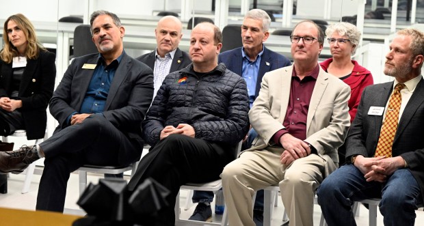CU Chancellor Justin Schwartz, left; Governor Jared Polis; Boulder Mayor Aaron Brockett; and Boulder Chamber CEO, John Tayer, spoke at a quantum incubator opening in east Boulder Wednesday.(Cliff Grassmick/Staff Photographer)