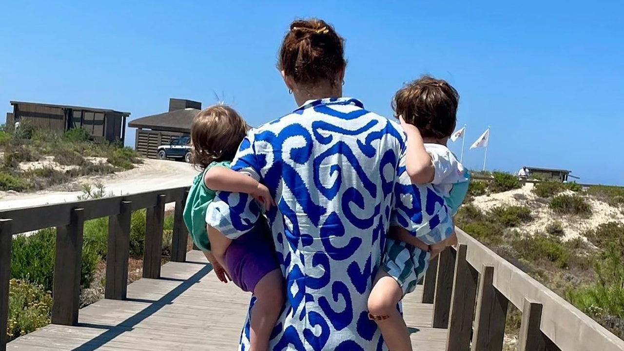 Princess Eugenie shares a rare photograph of herself with her two sons as they enjoy a day at the beach