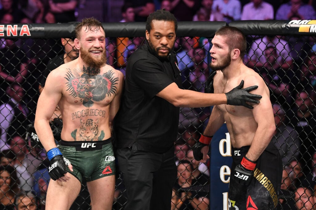 Referee Herb Dean seperates Conor McGregor of Ireland and Khabib Nurmagomedov of Russia in their UFC lightweight championship bout during the UFC 2...