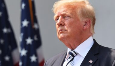 Trump in front of an American flag