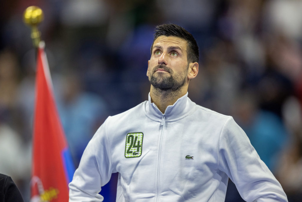 September 10: Novak Djokovic of Serbia, wearing his tracksuit top with number 24 before the trophy presentations after his victory against Daniil M...
