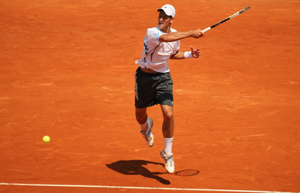 Novak Djokovic of Serbia and Montenegro in action against Rafael Nadal of Spain during day eleven of the French Open at Roland Garros on June 7, 20...