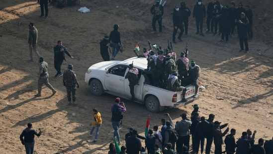 Freed prisoner Zakaria Zubeidi, a former high-profile commander of the Fatah group's Al Aqsa Martyrs Brigades,was escorted with great fanfare as people watched on(Raneena Sawafta/REUTERS)
