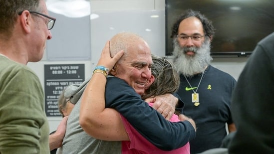 Three Israeli and five Thai hostages have been released from Gaza, in exchange for hundreds of Palestinian prisoners and detainees, in a hostage-prisoner exchange deal between Israel and Hamas on January 30, 2025. Eighty-year-old Gadi Moses is seen here reuniting with his family after the 15-month-long war between Israel and Hamas.(Maayan Toaf/GPO/Handout via REUTERS)