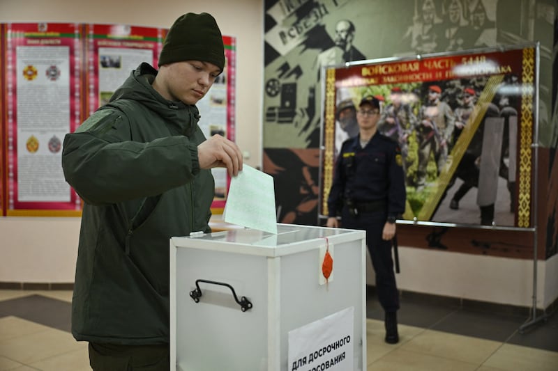 A Belarusian serviceman casts his ballot in Minsk this week during early voting in the country's presidential election. Photograph: Natalia Kolesnikova/AFP via Getty Images