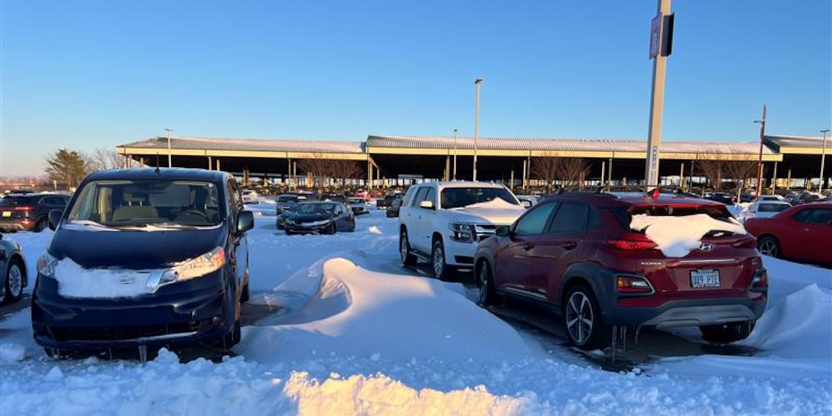 Snow and ice cover cars at KCI Economy Parking lot