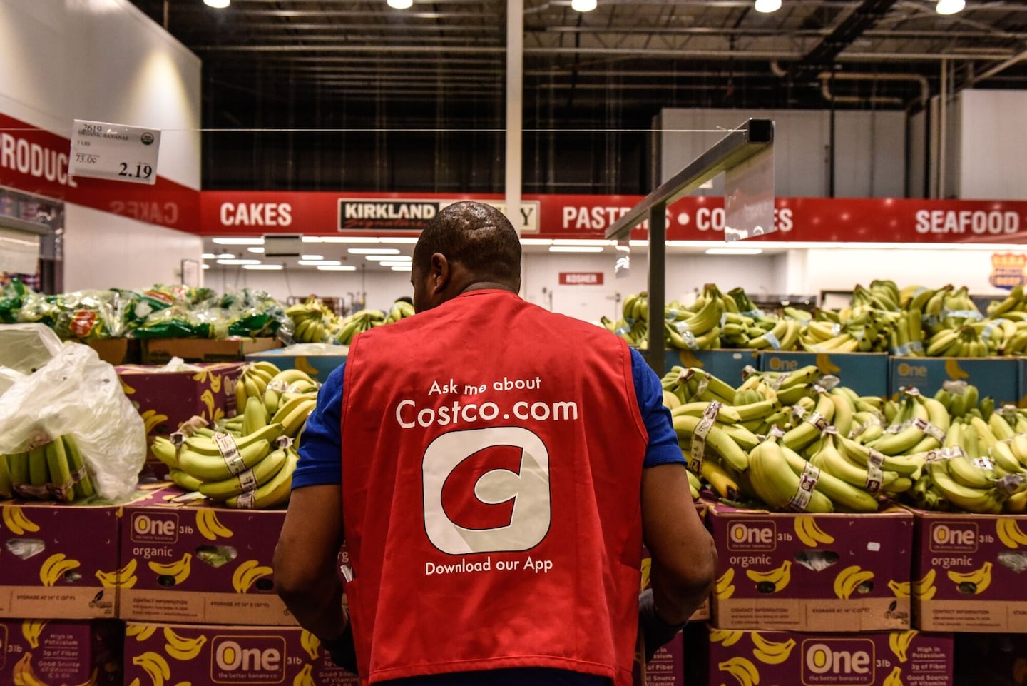A worker arranged produce at a Costco store in Teterboro, N.J.