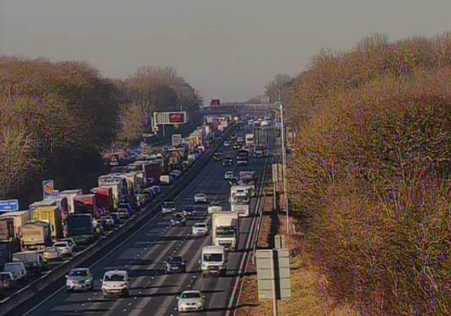Traffic camera showing a long queue on the M1 near Northampton after a crash.