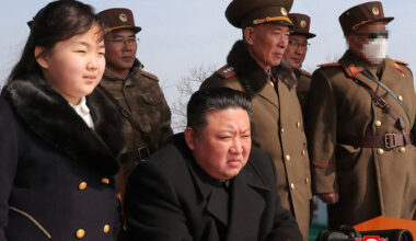 North Korea's leader Kim Jong Un and his daughter observing a warhead missile launch exercise simulating a tactical nuclear attack