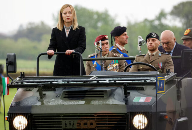 Italy's Prime Minister Giorgia Meloni reviews an honour guard as she attends a ceremony to mark the 163rd anniversary of the Italian Army, in Rome, Italy, May 3, 2024. REUTERS/Remo Casilli/File Photo