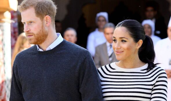 Prince Harry and Meghan Markle walking