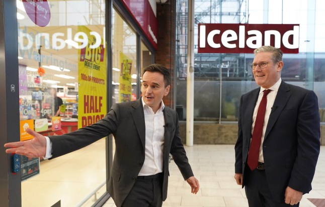 Labour leader Sir Keir Starmer (right) with executive chairman of Iceland supermarket, Richard Walker, during a visit to an Iceland store in Warrington. Mr Walker has given his backing to Labour, saying the party was the 